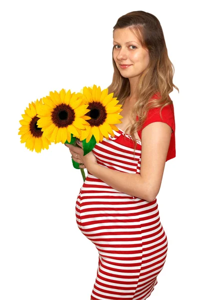 Беременная женщина и цветет — стоковое фото