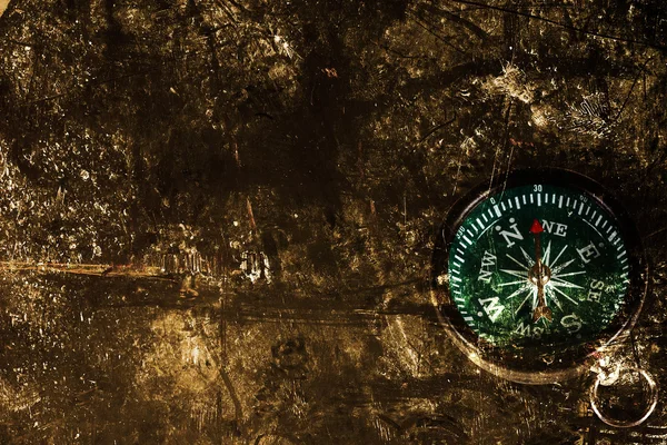 Dark edged paper and compass — Stock Photo, Image