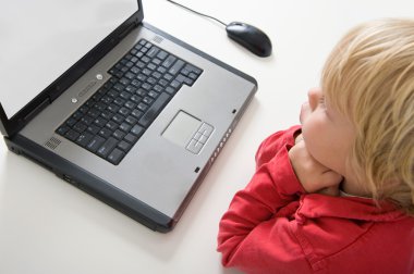 Boy behind laptop clipart