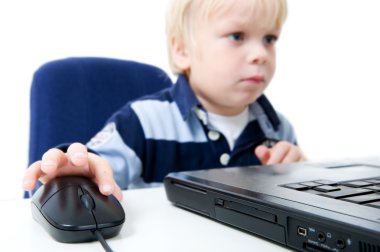 Young Boy Using Laptop clipart