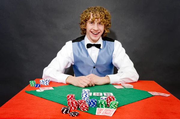 Smiling poker dealer — Zdjęcie stockowe