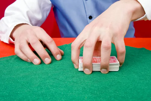 Grabbing a deck of cards — Stock Photo, Image