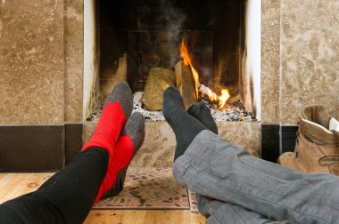 Warming by the fire clipart