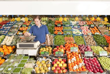 Greengrocer at work clipart