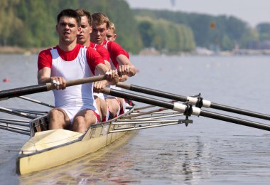 Rowing team during the start clipart