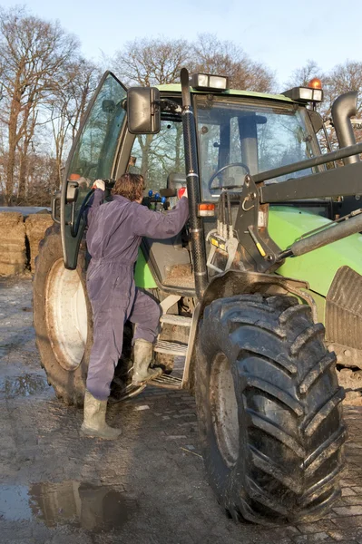 Boarding a tractor — Stock Photo, Image