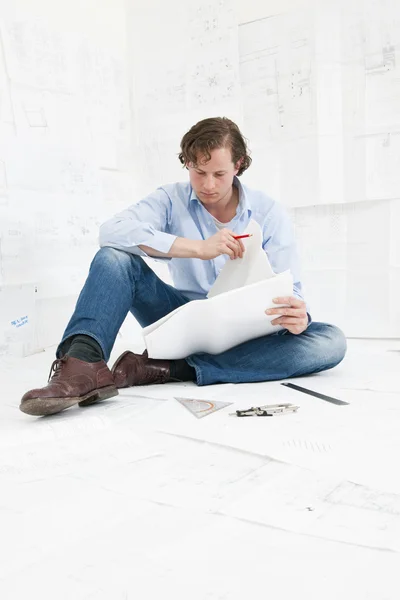 Engineer checking technical drawings — Stock Photo, Image
