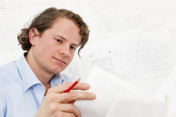 Reviewing technical drawings — Stock Photo, Image