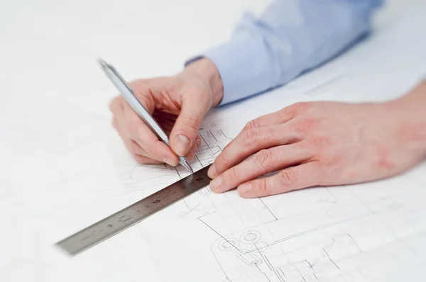 Engineer making adjustments in a drawing — Stock Photo, Image