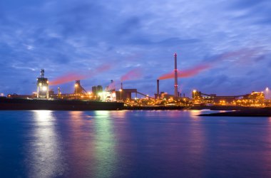 Steel plant at night clipart