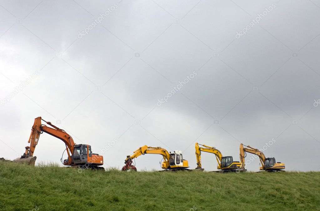 Four diggers on a dyke