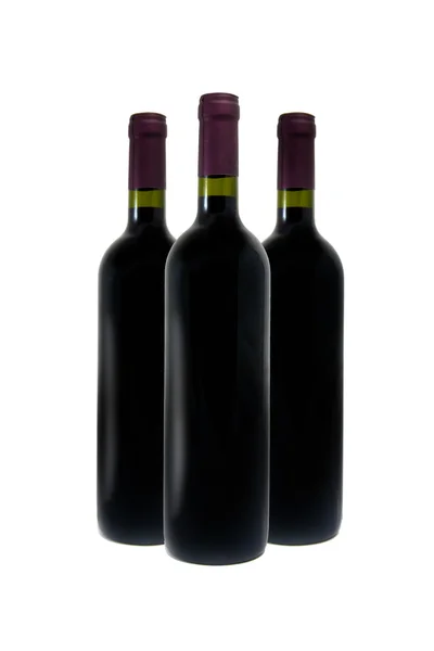 Röda vinflaskor — Stockfoto