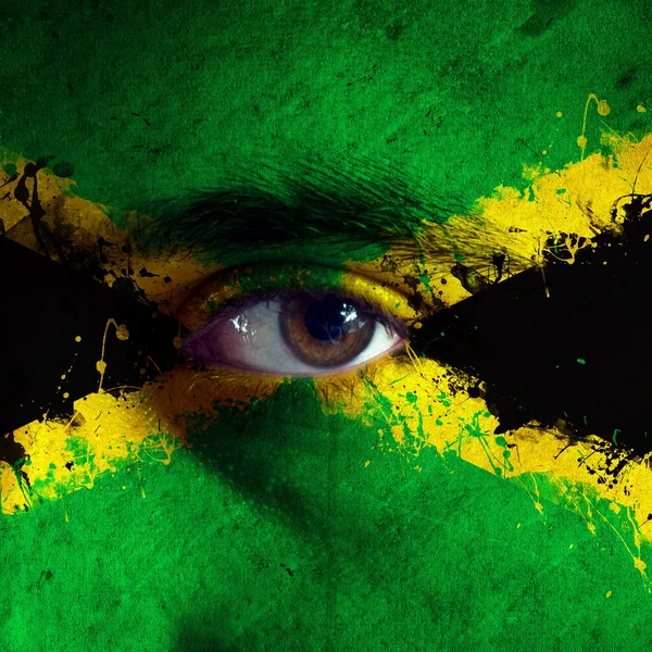 Jamaicas flagga på ansikte — Stockfoto