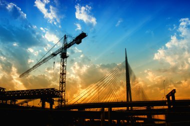 Construction crane in dusk clipart