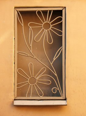 The metal grating on a remote curly window clipart