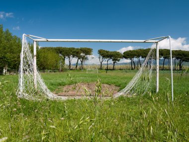 Football aka soccer pitch, unused, dilapidated clipart