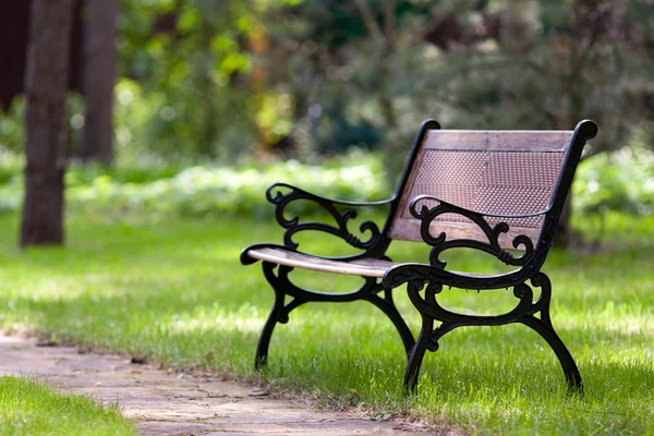 Stylish bench in park — Stock Photo, Image
