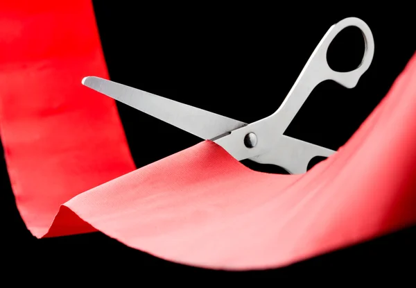 Scissors cutting ribbon — Stock Photo, Image