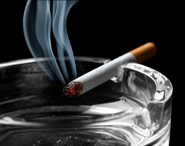 Cigarette on ashtray clipart