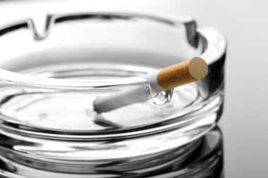 Cigarette on ashtray clipart