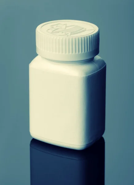 Garrafa pílulas brancas — Fotografia de Stock