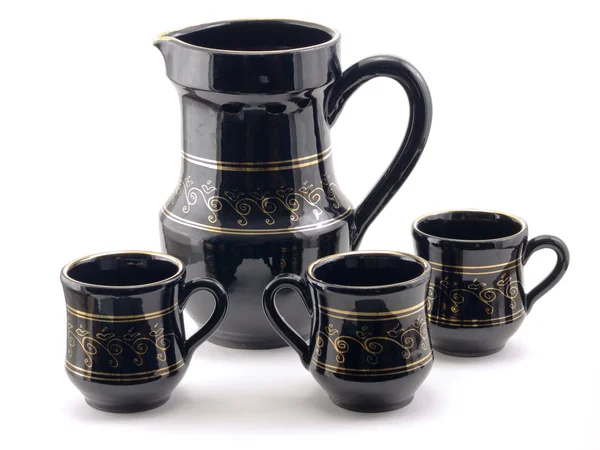 Pitcher and three mugs — Stock Photo, Image