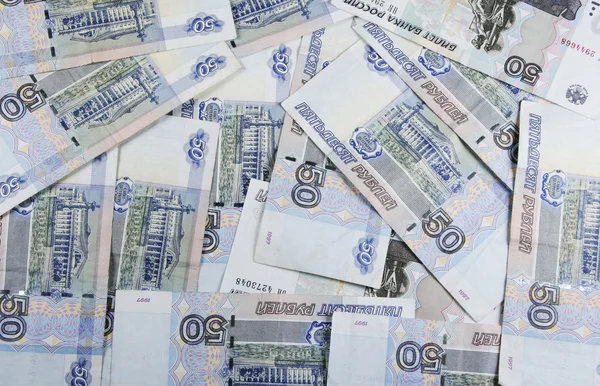 Achtergrond van het Russische monetaire merkt op vijftig roebels — Stockfoto
