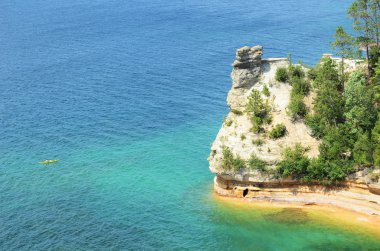 Kayaker Near Miners Castle at Pictured Rocks National Lakeshore clipart