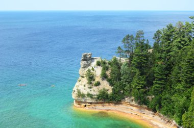 Kayakers by Miners Castle at Pictured Rocks National Lakeshore clipart