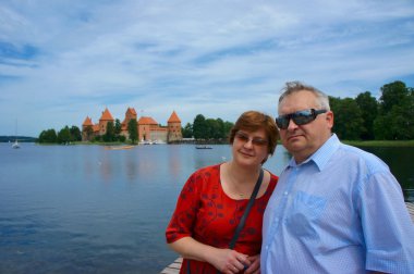 Mature couple travels to Europe clipart