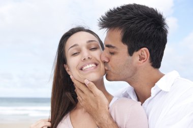 Portrait of a couple in love on the beach clipart