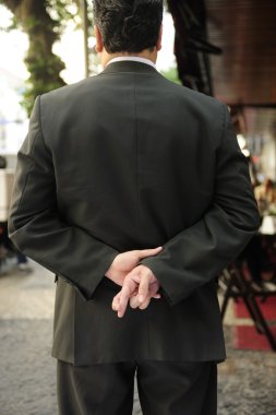 Liar: businessman with fingers crossed behind his back clipart