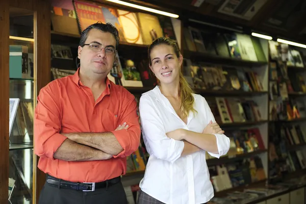 Family business partners owners of a small bookstore — Stock Photo, Image