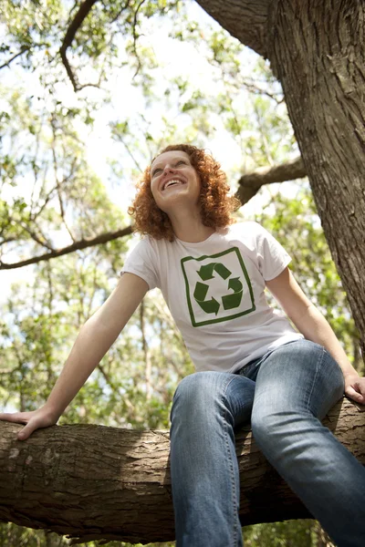 Volunteer with recycling t-shirt in the forest — Stockfoto