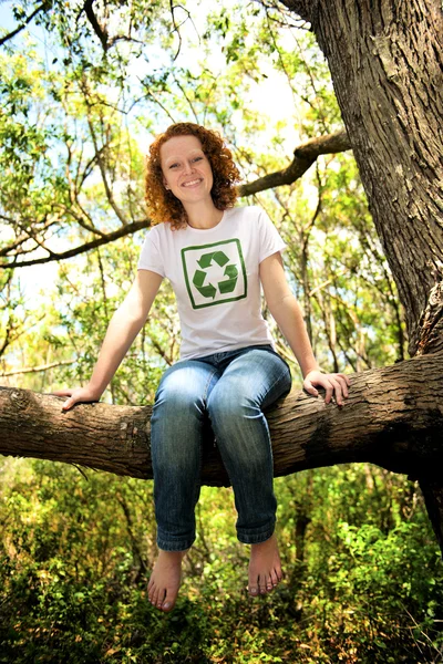 Volunteer with recycling t-shirt in the forest — Stockfoto