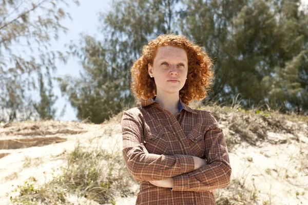 Portrait of a woman with red hair at the beach — Stock Photo, Image