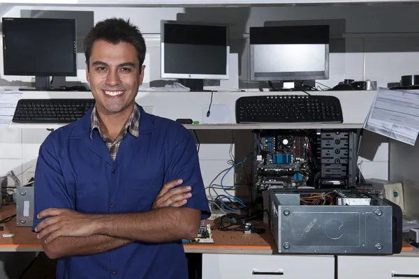 Small business owner of a computer repair store — Stock Photo, Image