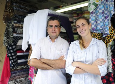 Family business partners owners of a fabric store clipart