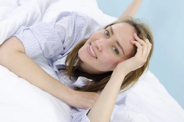 Portrait of a woman in bed — Stock Photo, Image