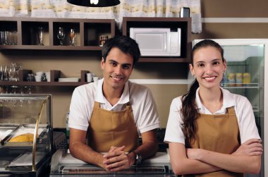 Waitress and waiter working at a cafe clipart