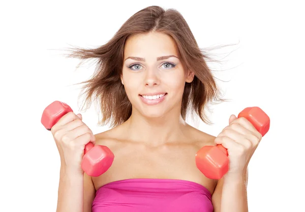 Beautiful slim woman with dumbbells Stock Image