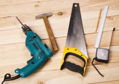 Carpenter's tools on pine desks clipart