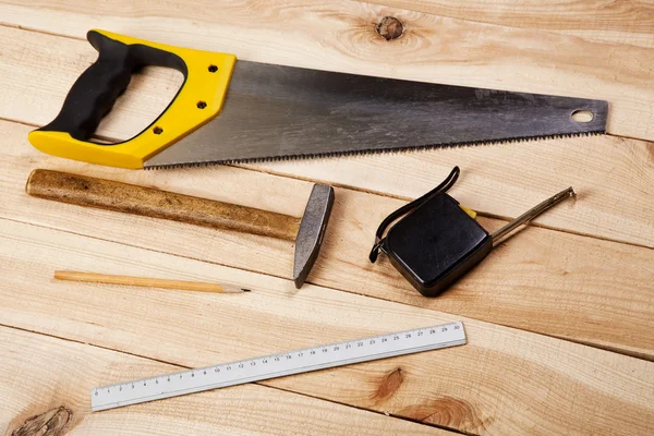 Carpenter's tools on pine desks — Stock Photo, Image