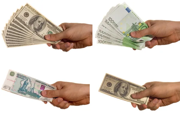 Доллар, евро и рублевые купюры в руке, изолированной от белого — стоковое фото