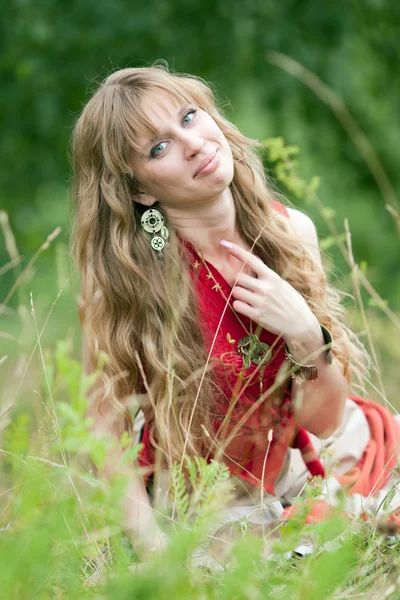 The girl of hippie in a grass — Stock Photo, Image