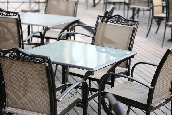 Empty tables in street cafe — Stock Photo, Image