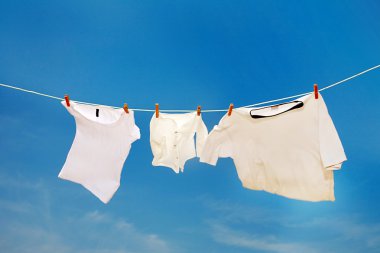 T-shirt drying on clothesline clipart