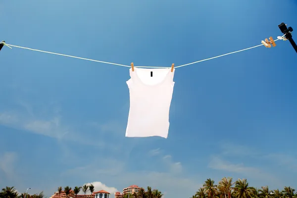 T-shirt drying on clothesline — Stock Photo, Image