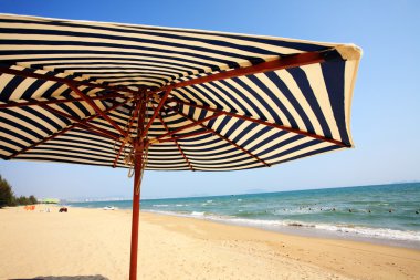 Sunshade and chairs on beach, Sanya, China clipart