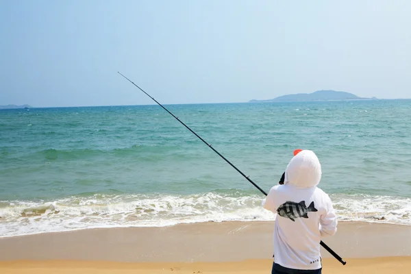 Fishing at the beach — Stock Photo, Image